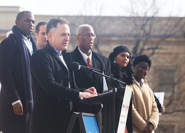 Richmond schools Superintendent Jason Kamras addresses the marchers from the steps of the State Capitol last Saturday. Among those on the podium with him are, from left, Richmond Mayor Levar M. Stoney, who led the March for More effort, 4th District Congressman A. Donald McEachin and Shadae Thomas Harris, chief engagement officer for Richmond Public Schools.