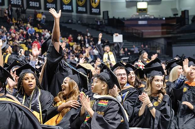 Virginia Commonwealth University fall commencement speaker Christy Coleman offers graduates words of advice during a ceremony last Saturday at the Siegel Center. Graduates celebrate their new degrees during the ceremony.