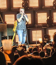 Eric Church performing at Cynthia Woods Mitchell Pavilion
