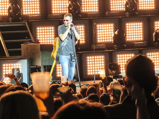 Eric Church performing at Cynthia Woods Mitchell Pavilion