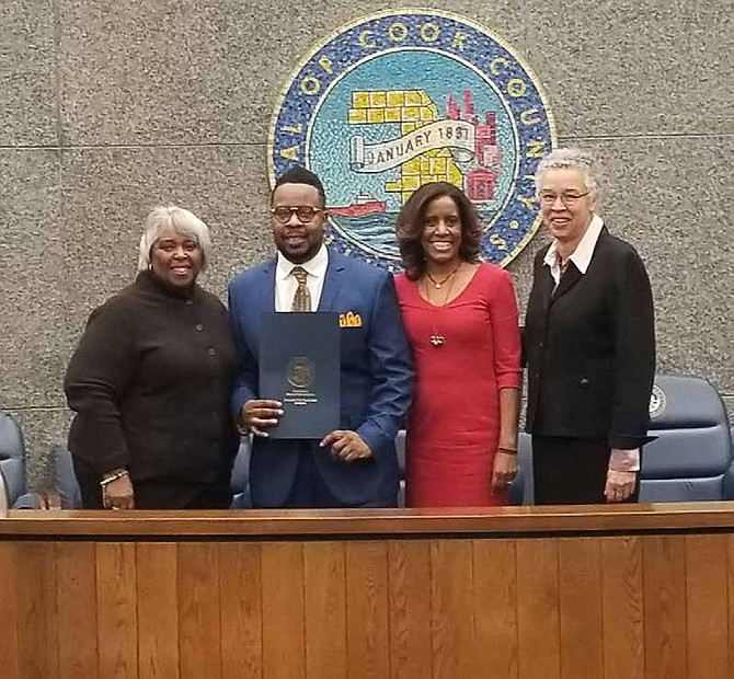 Early Walker (second from left), owner and CEO of W&W Towing, was recently honored by the Cook County Board of Commissioners. Photo Credit: Provided by Early Walker