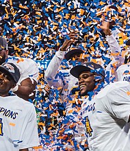 Members of the North Carolina A&T State University football team are showered with confetti after last Saturday’s 24-22 victory over Alcorn State University in the Air Force Reserve Celebration Bowl played at Mercedes-Benz Stadium in Atlanta.