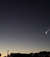 A bright, strange-looking light streaked across Northern California Wednesday night, its appearance coinciding with a scrapped rocket launch and leaving the Twitterverse asking, "So, what's that in the sky?"