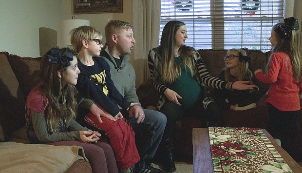 Rutherfordton Army National Guardsman Brandon Whiteside, who was in Iraq for about nine months, was wrapped as a present to surprise his kids.