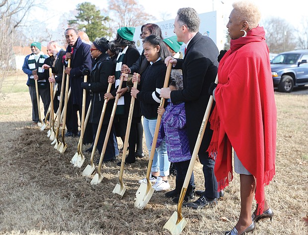 Richmond Mayor Levar M. Stoney, center, asks Superintendent Jason Kamras, second from right, to lead Wednesday’s groundbreaking ceremony at E.S.H. Greene Elementary School in Spanish in recognition of the large Spanish-speaking population at the South Side school. Mr. Kamras offered some of his remarks to the small crowd of students, school officials, School Board and City Council members in Spanish.