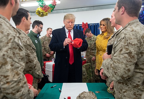 President Donald Trump made his first visit to a war zone on Wednesday, receiving an enthusiastic reception from many US …