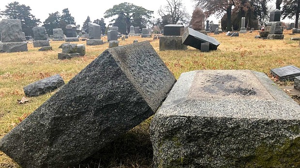 The city of Olathe is investigating after dozens of headstones were found vandalized.