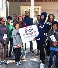 Young members of Community Movement Builders in Atlanta stage a protest against gentrification in a section of the city that threatens to displace black working class and poor people.
