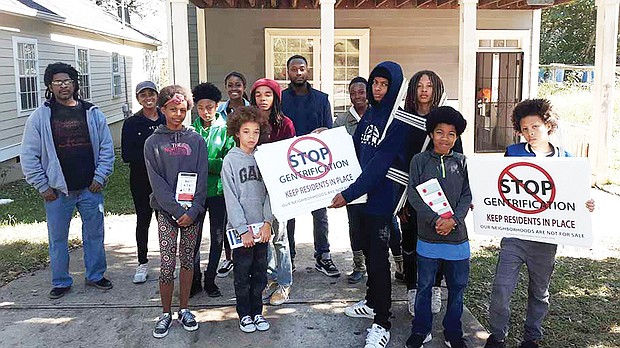 Young members of Community Movement Builders in Atlanta stage a protest against gentrification in a section of the city that threatens to displace black working class and poor people.