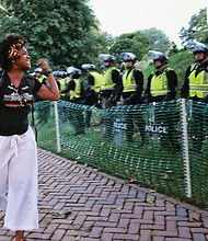A University of Virginia student expresses her disgust at State Police who blocked off part of the Charlottesville campus in August in anticipation of protesters on the first anniversary of the 2017 white supremacist rally in the city in which one woman was killed and dozens of others were injured when a neo-Confederate drove his car into a crowd of counterprotesters.
