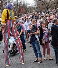Christopher Hudert walks on stilts high above the crowds enjoying the annual Easter on Parade celebration on Monument Avenue in April.
