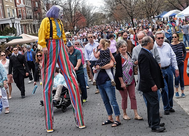 Christopher Hudert walks on stilts high above the crowds enjoying the annual Easter on Parade celebration on Monument Avenue in April.