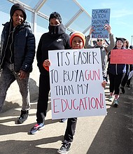 A young marcher champions his message as thousands of people turned out to demand gun control and school safety during the March for Our Lives demonstration in March from Martin Luther King Jr. Middle School to the State Capitol.