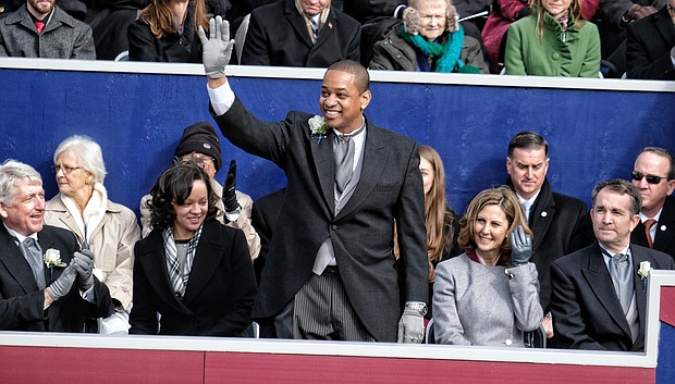 Lt. Gov. Justin E. Fairfax waves to a cheering crowd after taking the oath of office in January. He is only the second African-American to be elected to statewide office in Virginia. His wife, Dr. Cerina Fairfax, a dentist, is seated next to him with Attorney General Mark Herring and First Lady Pam Northam and Gov. Ralph S. Northam, right.