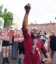 Hip-hop musician J. Roddy Rod joins a crowd of more than 300 people at a June rally and march protesting the shooting death of Marcus-David Peters, 24, by a Richmond Police officer.