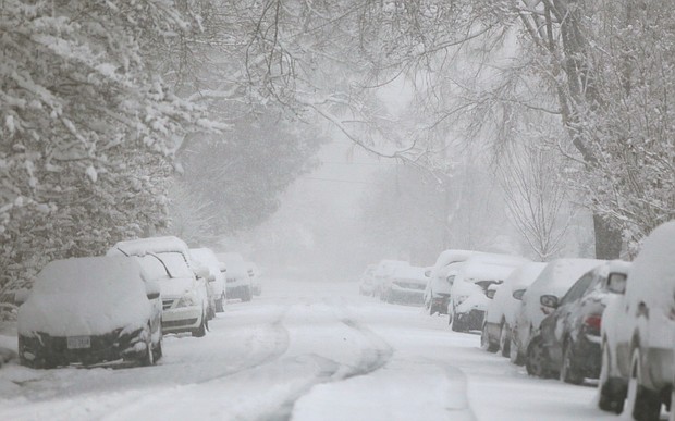 A wind-blown blanket of snow covers a North Side neighborhood in early December, when nearly a foot of snow fell in Metro Richmond. It was the second largest snowfall in the city in December since 1908.