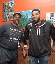 Hometown celebration: Boston Red Sox centerfielder Jackie Bradley Jr., right, spends time with his dad, Jackie Bradley Sr. of Richmond, during a celebration held for the pair on Dec. 28 by the older Mr. Bradley’s co-workers at GRTC. In late October, the younger Mr. Bradley helped the Red Sox clinch a World Series victory over the Los Angeles Dodgers. A Richmond area native, he played ball for Prince George High School and the University of South Carolina before joining the Red Sox, where he has been the starting centerfielder since 2014. His dad is a veteran bus driver for GRTC. The festive celebration was held at Southern Kitchen restaurant in Shockoe Bottom. (James Haskins/Richmond Free Press)