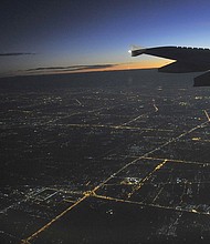 A young Saudi woman says she is being detained at Bangkok's main airport after trying to escape from her parents in Kuwait.