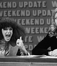 Gilda Radner, left, as Roseanne Roseannadanna, with Jane Curtin during "SNL's" "Weekend Update."