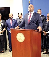 Delegate Lamont Bagby of Henrico County, chairman of the Virginia Legislative Black Caucus, is flanked by caucus during Wednesday’s news conference on the General Assembly’s opening day.