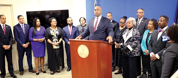 Delegate Lamont Bagby of Henrico County, chairman of the Virginia Legislative Black Caucus, is flanked by caucus during Wednesday’s news conference on the General Assembly’s opening day.
