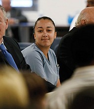 Cyntoia Brown smiles at family members during a May 2018 clemency hearing at Tennessee Prison for Women in Nashville. She was serving a life sentence for killing a man in 2004 when she was a 16-year-old sex trafficking victim.