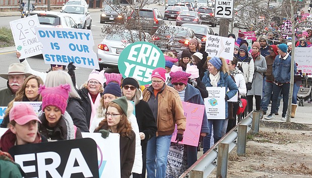Hundreds of participants calling for equal rights walk the 2-mile loop from the Arthur Ashe Jr. Athletic Center on the Boulevard to Broad Street during last Saturday’s Women’s March RVA.