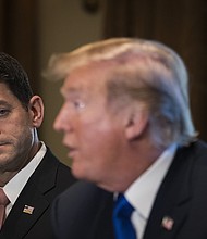 Paul Ryan looks on as President Donald Trump speaks about tax reform legislation during a meeting with members of the House Ways and Means Committee in the Cabinet Room at the White House, November 2, 2017 in Washington, DC.