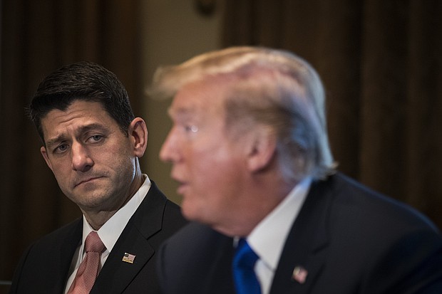 Paul Ryan looks on as President Donald Trump speaks about tax reform legislation during a meeting with members of the House Ways and Means Committee in the Cabinet Room at the White House, November 2, 2017 in Washington, DC.