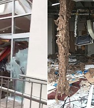A view showing the damage caused when a mechanical digger was driven through the front of the Travelodge hotel in Edge Lane, Liverpool, England, Monday Jan. 21, 2019. Video footage of the incident which has gone viral online shows the vehicle repeatedly smashing through the reception of the hotel, which is under construction and was set to be completed on Monday.