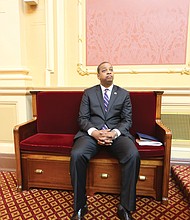Above, Lt. Gov. Justin E. Fairfax takes a seat in the Senate chamber last Friday rather than preside at the dais when Republican state Sen. Richard H. Stuart of King George County asks that the body adjourn for the day in honor of Confederate Gen. Robert E. Lee.
