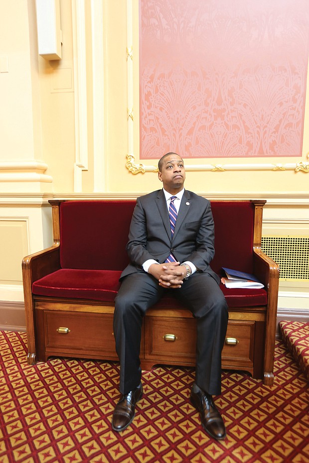 Above, Lt. Gov. Justin E. Fairfax takes a seat in the Senate chamber last Friday rather than preside at the dais when Republican state Sen. Richard H. Stuart of King George County asks that the body adjourn for the day in honor of Confederate Gen. Robert E. Lee.
