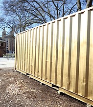 This is the portal that awaits visitors in Monroe Park. Despite the simple shipping container exterior, the interior includes high-tech equipment that provides connections to cities around the world.
