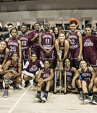The VUU Lady Panthers pose with their Freedom Classic championship trophy after defeating VSU 73-49 last Saturday.