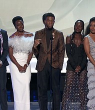 The cast of Black Panther (2018) on stage at the 2019 SAG Awards accepting the award for Best Ensemble.