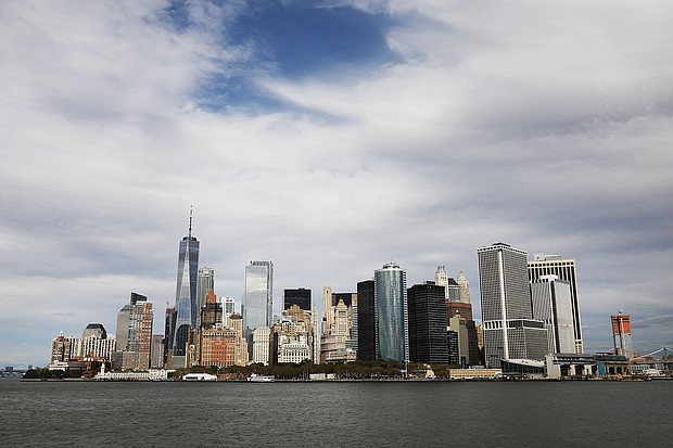 The Manhattan skyline  towers over New York harbor on October 16, 2017 in New York City.