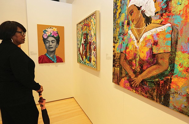Patricia Lancaster of Chesterfield County browses the work on view at “The Art of Freedom” exhibit at the Black History Museum & Cultural Center in Jackson Ward. The exhibit, which is on view through May 19, includes more than 60 works in various mediums by 36 African-American artists born or living in Virginia who express their meaning of freedom.