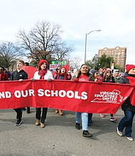 Marching for education: People of all ages wearing red hats, scarves, jackets and shirts signal their support for more state money for public education in Virginia during Monday’s #RedforEd march and rally from Monroe Park to the State Capitol. State lawmakers meeting at the General Assembly session said they will support a 5 percent pay hike for Virginia’s teachers. (Regina H. Boone/Richmond Free Press)