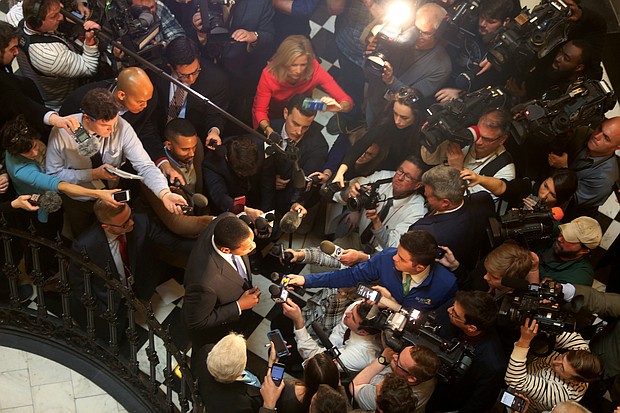 Lt. Gov. Justin E. Fairfax, center, is swarmed by reporters Monday inside the Capitol Rotunda as he responds to an allegation that he sexually assaulted a woman in 2004. He has denied the allegation.