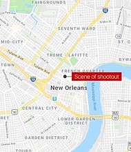 Five people waiting at a bus stop in New Orleans were shot during a police shootout with a robbery suspect Sunday, police said.