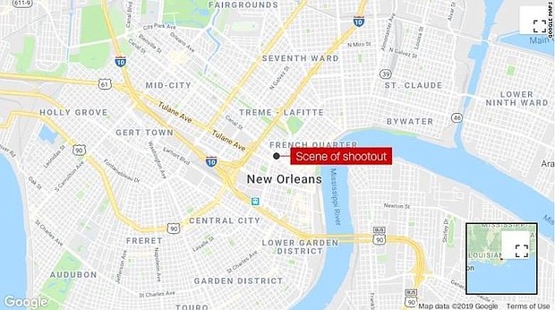 Five people waiting at a bus stop in New Orleans were shot during a police shootout with a robbery suspect Sunday, police said.