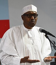 President Muhammadu Buhari delivers a speech during his party's emergency meeting on the postponed general elections in the capital city of Abuja.