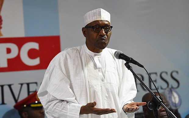 President Muhammadu Buhari delivers a speech during his party's emergency meeting on the postponed general elections in the capital city of Abuja.