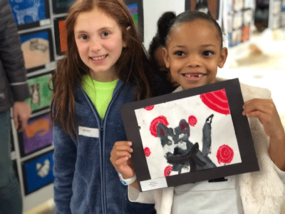Grade 2 Calvert School students Sydney Bramble (left) and Jalen Marsiglia (right) with their artwork submissions.