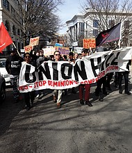 Protesters head down Franklin Street to the State Capitol during Monday’s March of Reckoning calling for the resignation of the state’s top three elected officials and a halt to Dominion Energy’s natural gas pipeline and compressor station in the historically African-American community of Union Hill in Buckingham County.