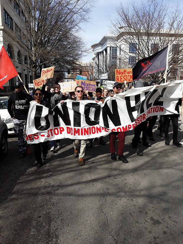 Protesters head down Franklin Street to the State Capitol during Monday’s March of Reckoning calling for the resignation of the state’s top three elected officials and a halt to Dominion Energy’s natural gas pipeline and compressor station in the historically African-American community of Union Hill in Buckingham County.