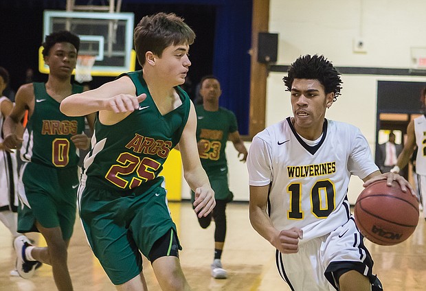 Carver Academy’s Mikael “Mick” Jaaber goes in for a basket during Monday’s regional playoff game against Appomattox Regional Governor’s School.