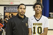 Mikael Jaaber smiles with his dad, former Virginia Union University basketball standout, Luqman Jaaber, who is an assistant coach for Carver Academy’s varsity team.
