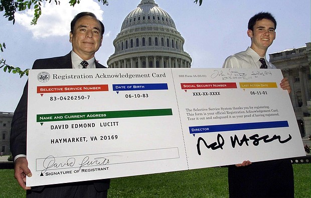 Director of the US Selective Service System, Alfred Rascon (L) and David Edmond Lucitt, 18, of Haymarket, Virginia, July 11, 2001. US District Court Judge Gray Miller ruled late Friday that the Military Selective Service Act's male-only registration is unconstitutional.