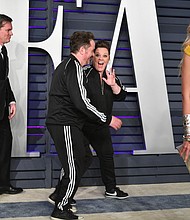 While most celebrities who attended the Oscars Sunday night slipped into their second look of the evening before hitting up the after-parties, Melissa McCarthy and her husband Ben Falcone had something else in mind. The couple turned up at Vanity Fair's bash wearing matching Adidas tracksuits.